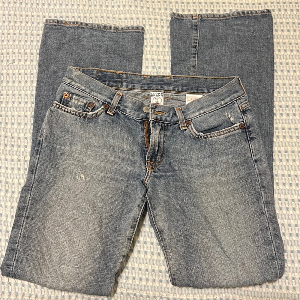 Lucky Brand women’s jeans. Bootcut. Small rips. Size 2
